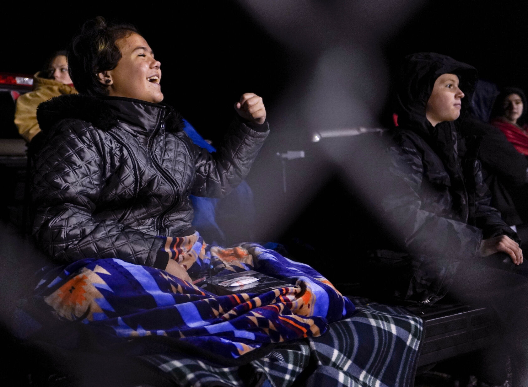 Sophia Bushnell watches the Southern Boone football game from outside the stadium